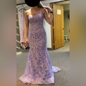 I’m selling this size 4 Prom Dress in the color lilac purple.